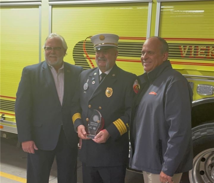 SERVPRO Employees with Firefighter of the year