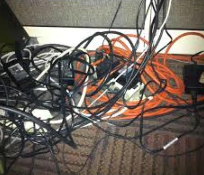wires tangled with cords unorganized 
