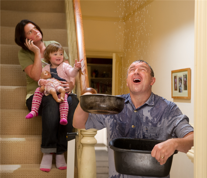 A family deals with water leaking from their ceiling.