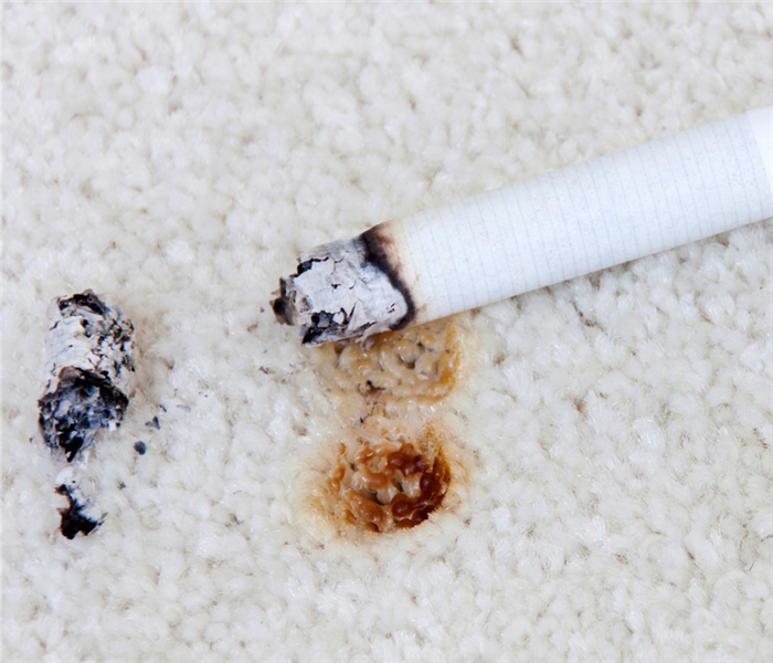 cigarette burn hole in carpet