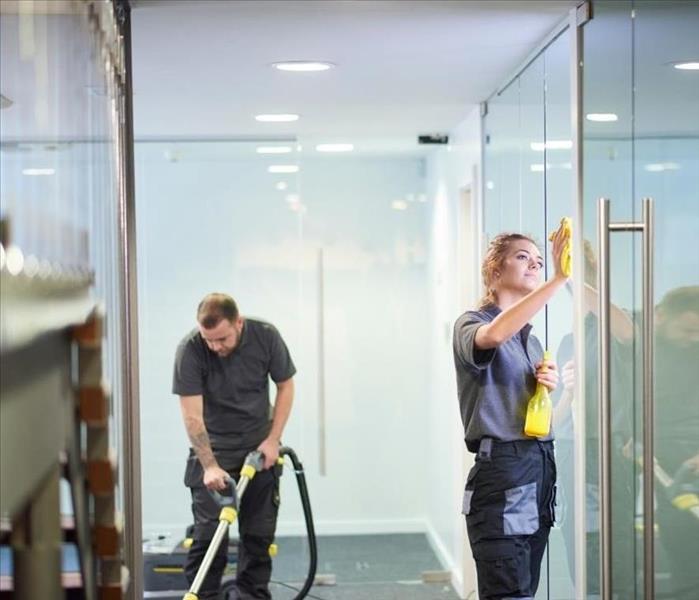 Pictures show two people cleaning a commercial space 