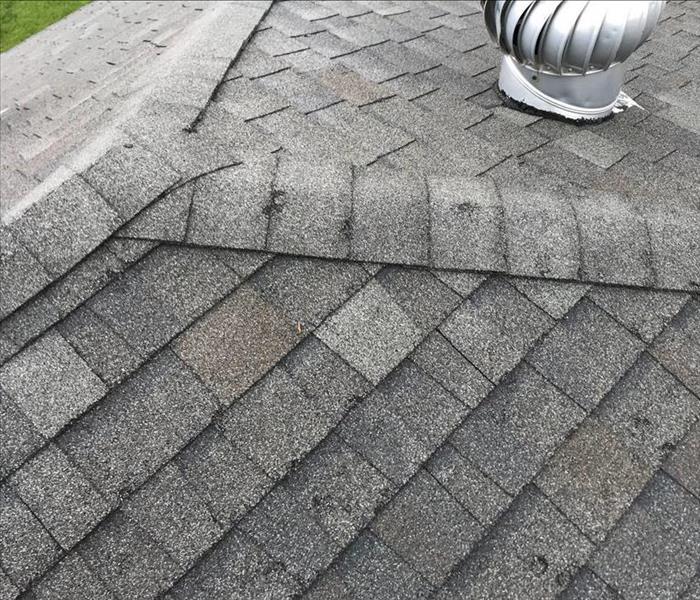 image of severe hail damage to a residential roof