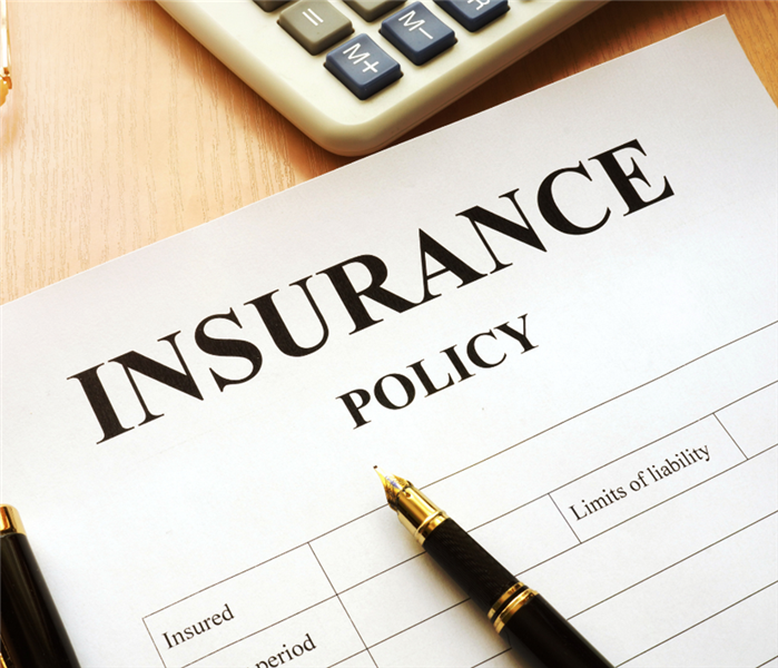 Picture is a close up of a paper insurance policy 
